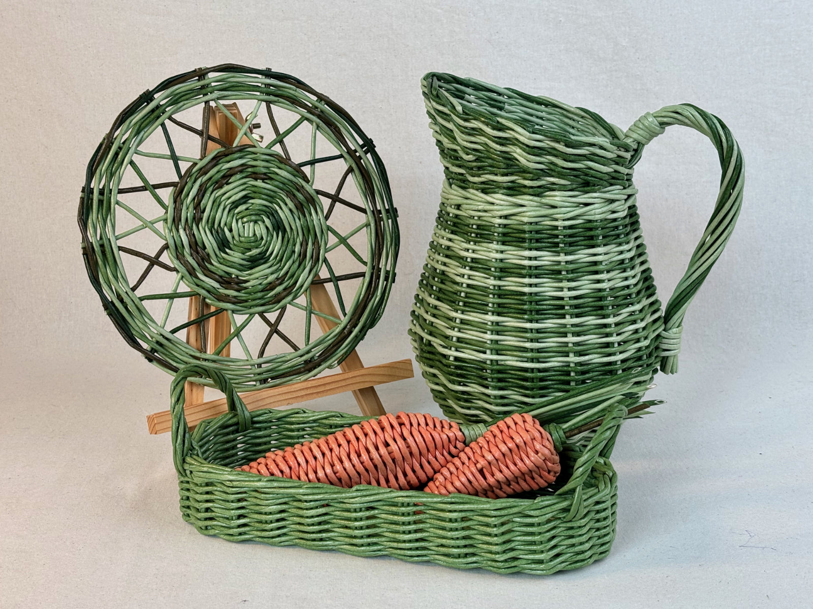 Woven paper vine green pitcher, green napkin, green tray, and orange carrots