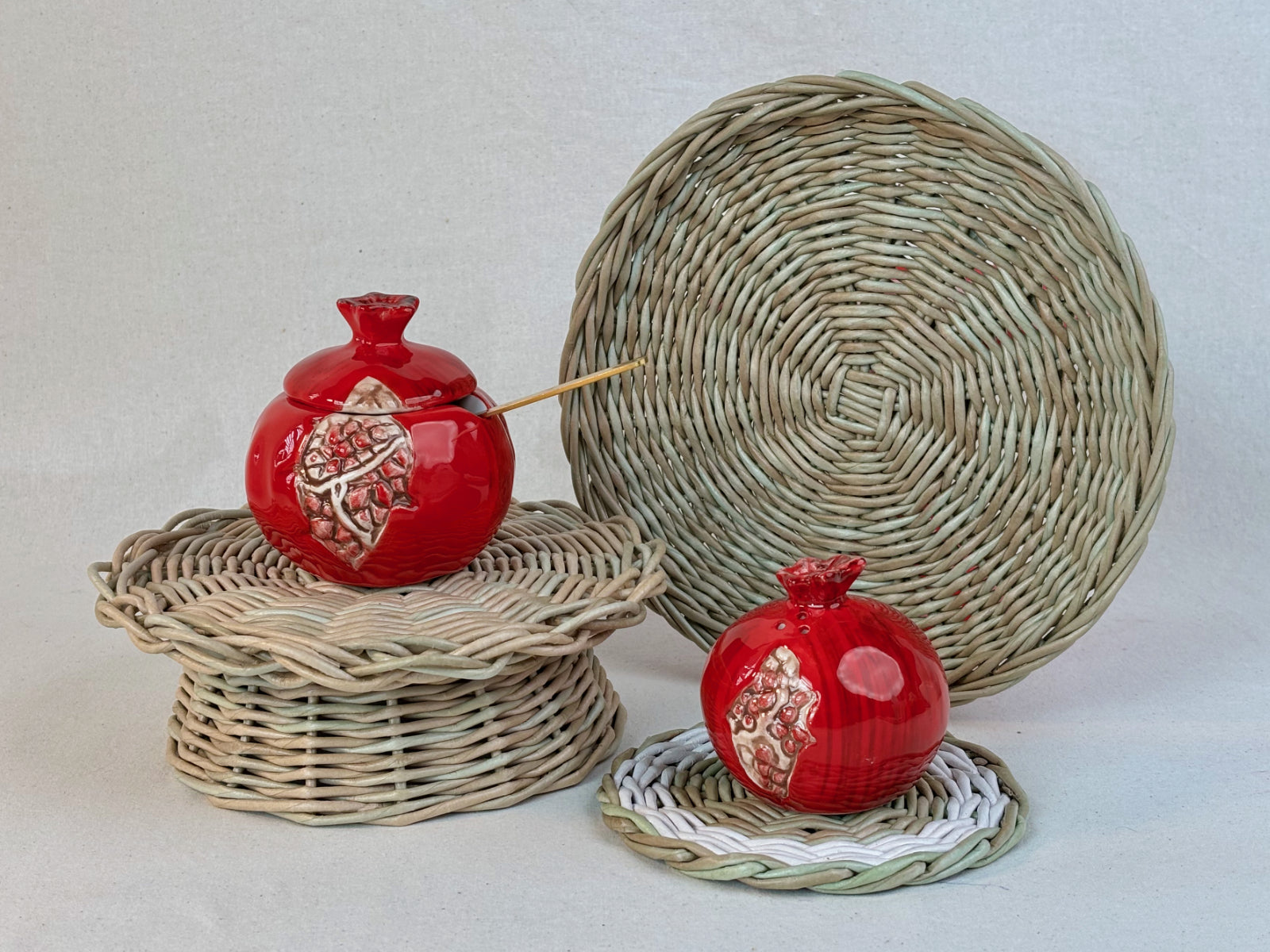 Woven paper vine tray, a woven coaster, and a woven table riser